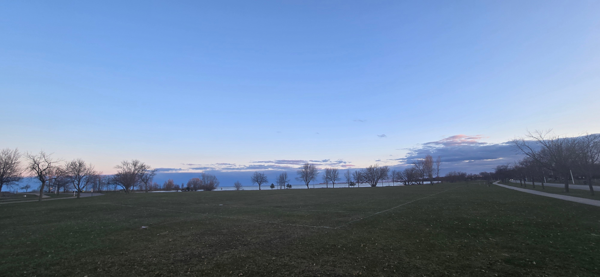 Ludington Park home pitch at dusk, Little Bay de Noc in the distance