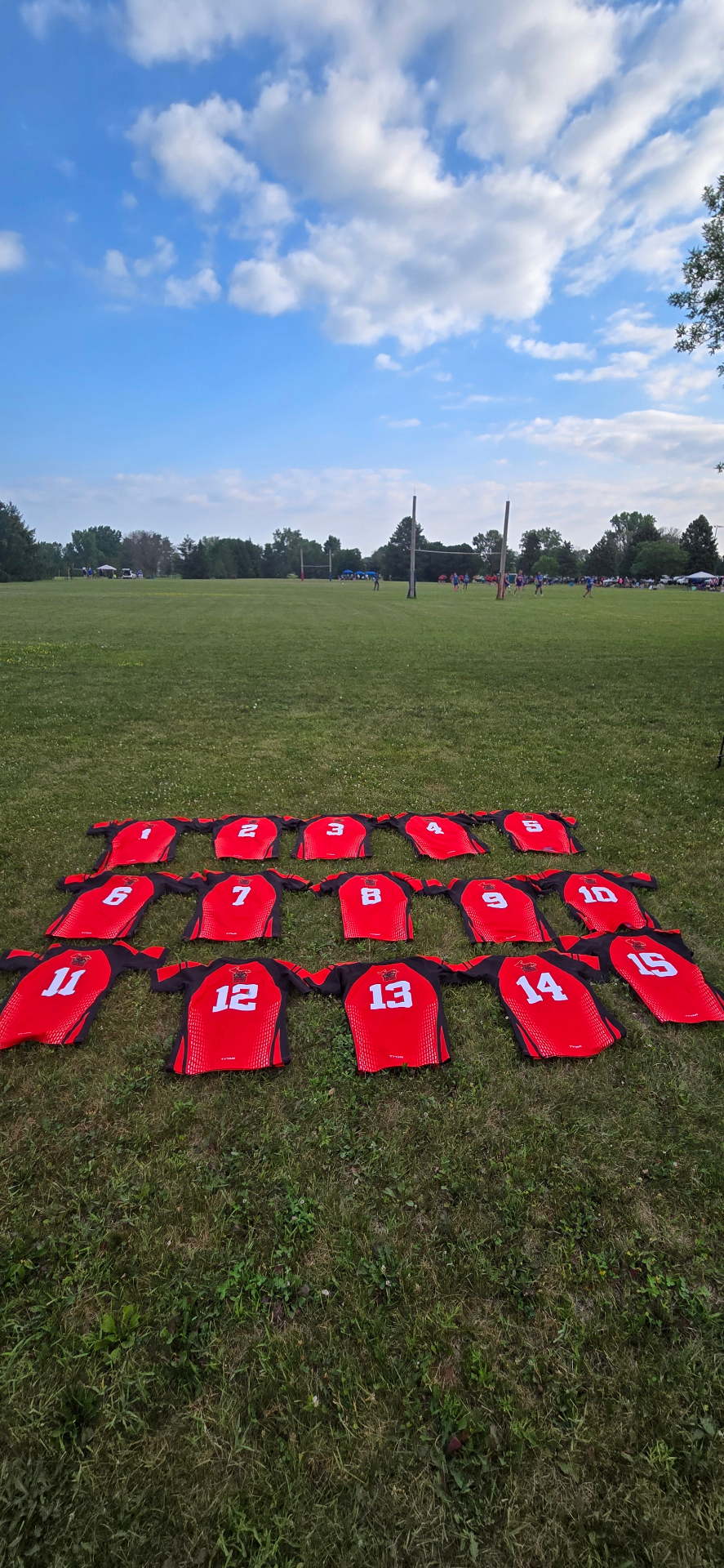Berserkers red jerseys laid out on the rugby pitch